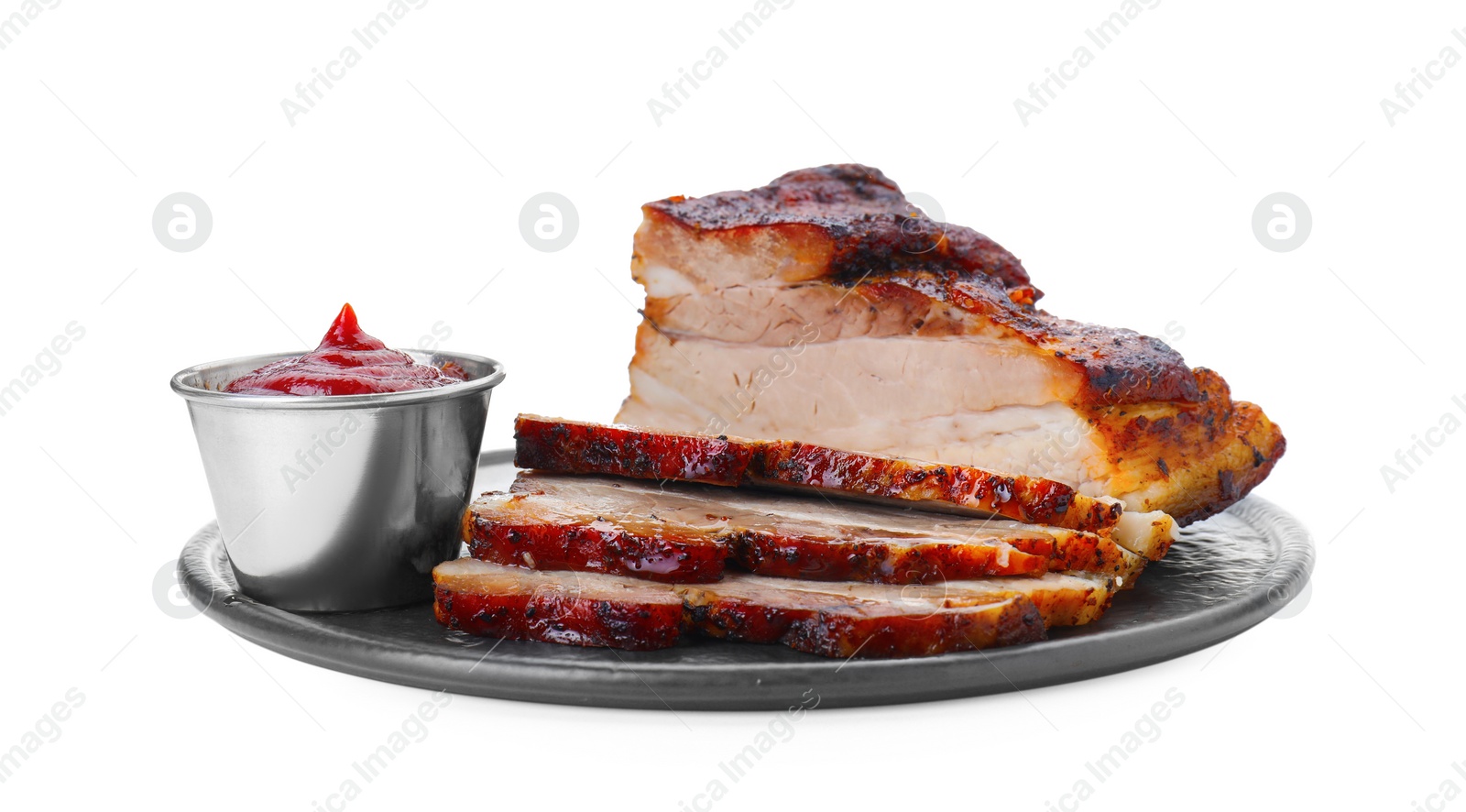 Photo of Pieces of tasty baked pork belly and sauce isolated on white