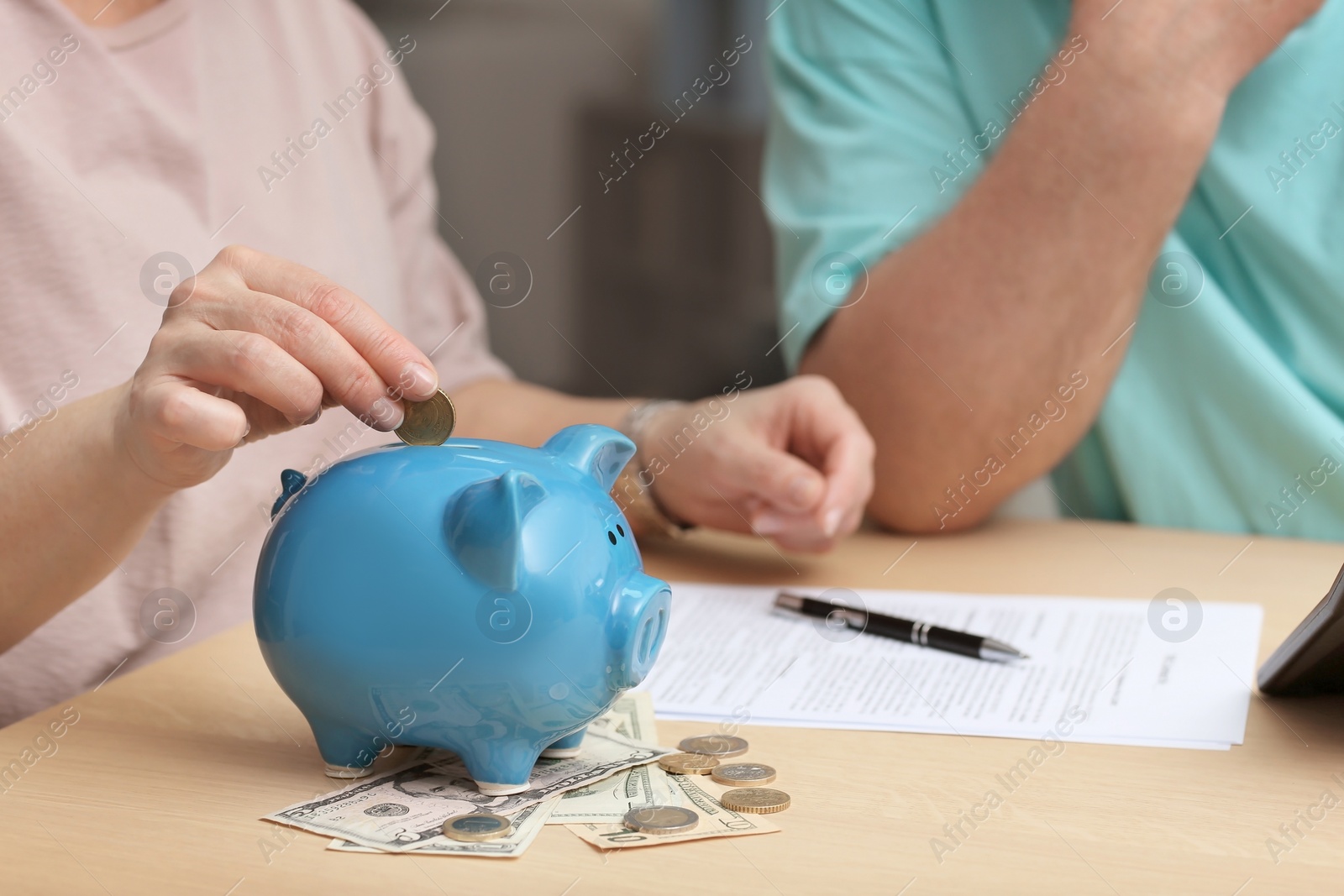 Photo of Mature couple thinking over pension payment at home, closeup