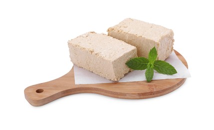 Photo of Board with pieces of tasty halva and mint isolated on white