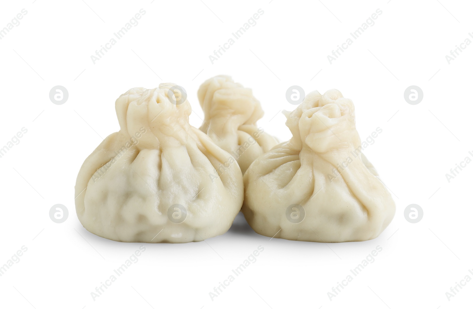 Photo of Three tasty khinkali (dumplings) isolated on white. Georgian cuisine