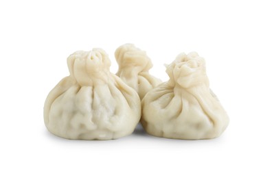 Photo of Three tasty khinkali (dumplings) isolated on white. Georgian cuisine