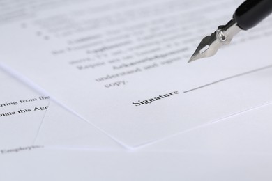 Photo of Signing notary document with fountain pen, closeup. Space for text