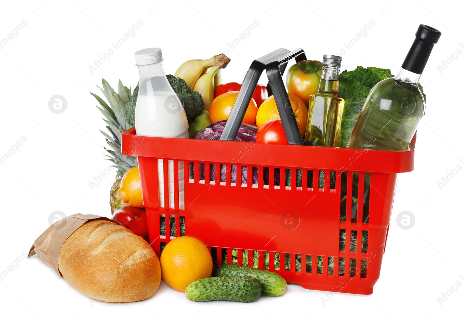 Photo of Shopping basket and grocery products on white background