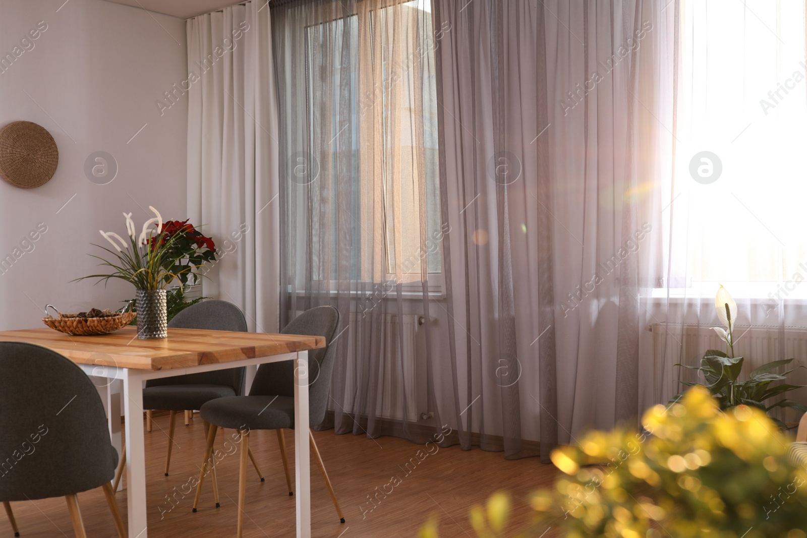 Photo of Windows with stylish curtains in living room interior