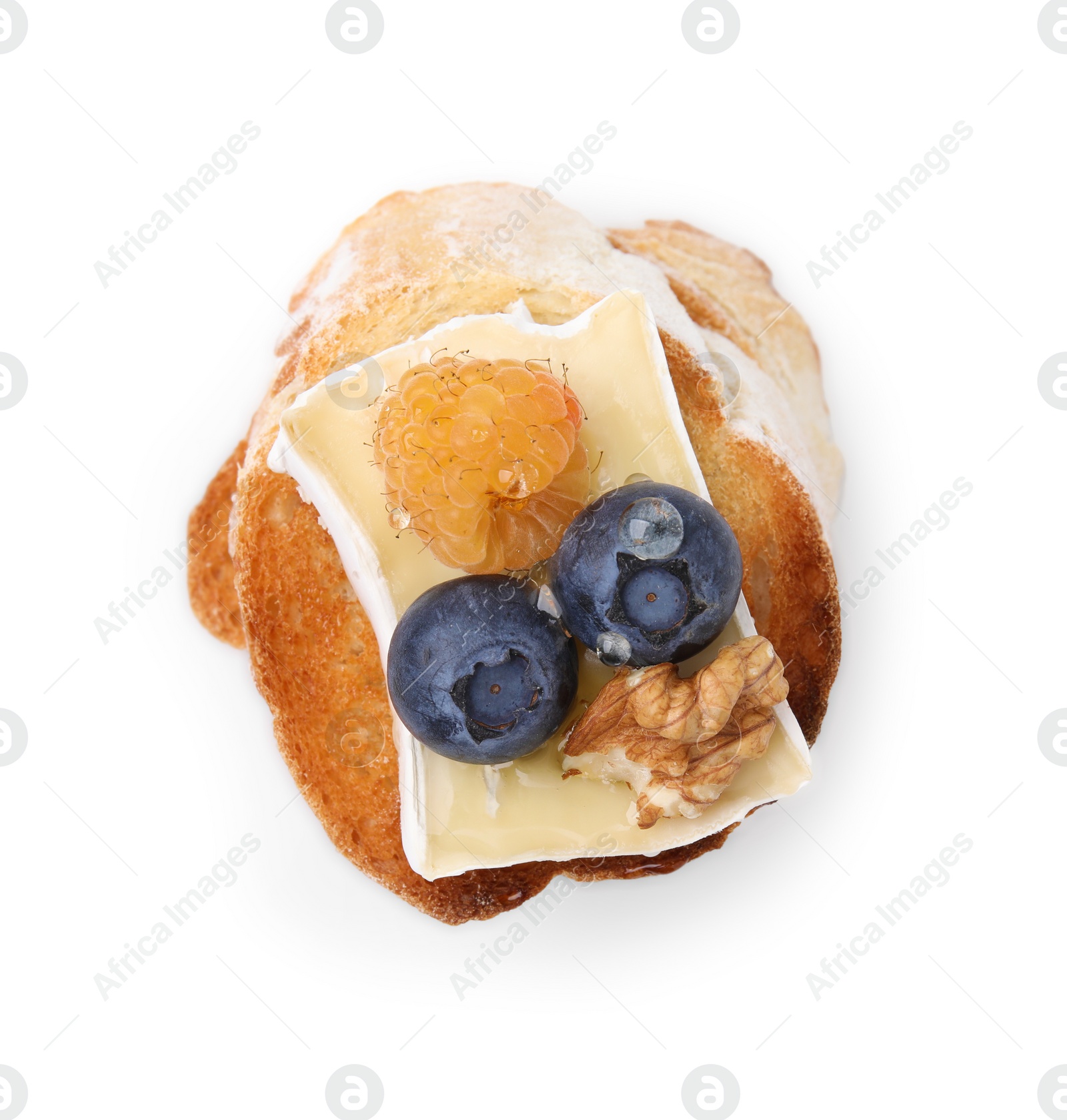 Photo of Tasty sandwich with brie cheese, fresh berries and walnut isolated on white, top view