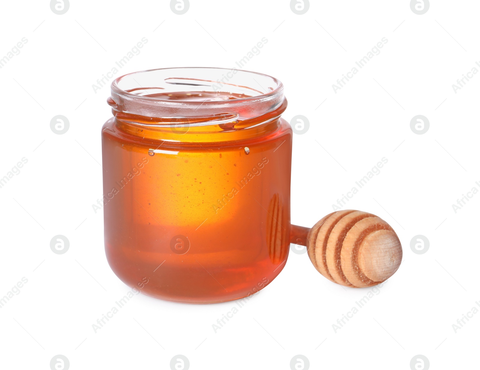 Photo of Tasty natural honey in glass jar and dipper isolated on white