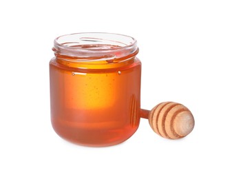 Photo of Tasty natural honey in glass jar and dipper isolated on white