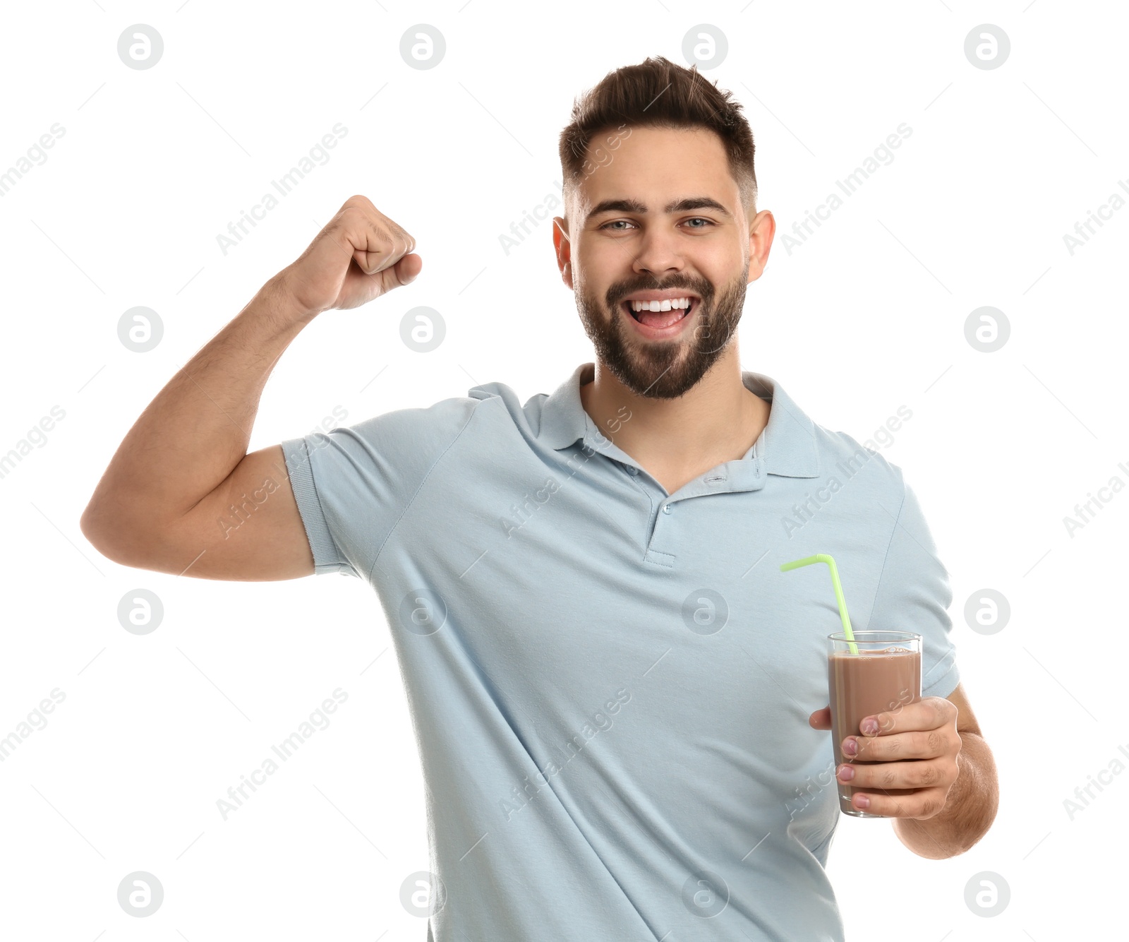 Photo of Young man with glass of chocolate milk showing his strength on white background