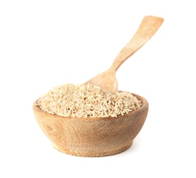 Bowl with uncooked brown rice and spoon on white background