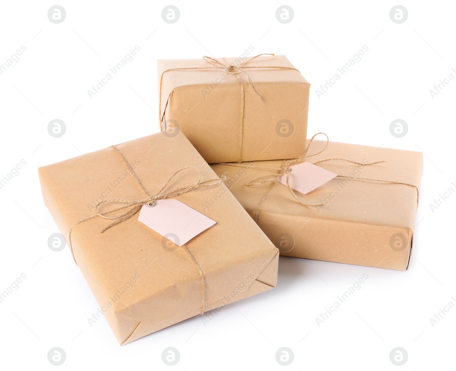 Photo of Parcels wrapped in kraft paper on white background