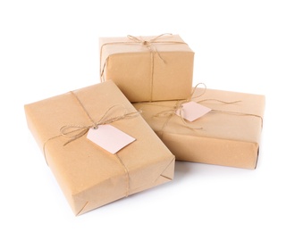 Parcels wrapped in kraft paper on white background