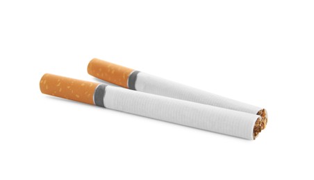 Photo of Cigarettes with orange filters isolated on white