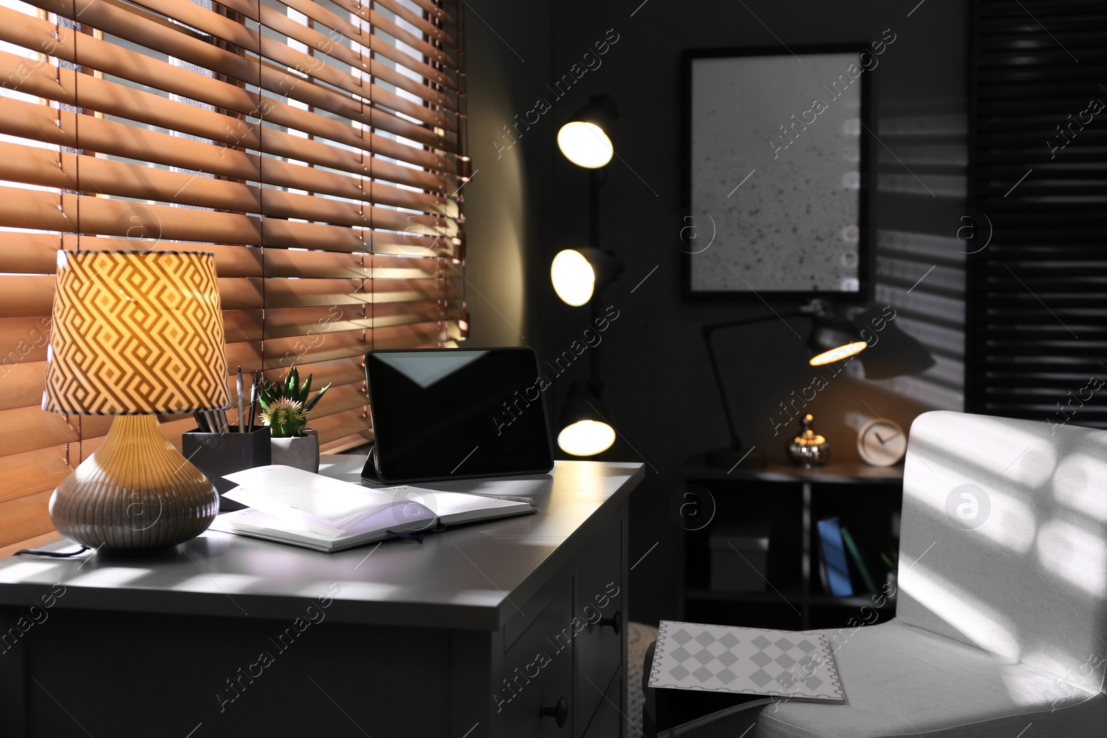 Photo of Stylish room interior with comfortable workplace near window