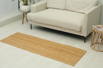 Photo of Stylish rug on floor in living room