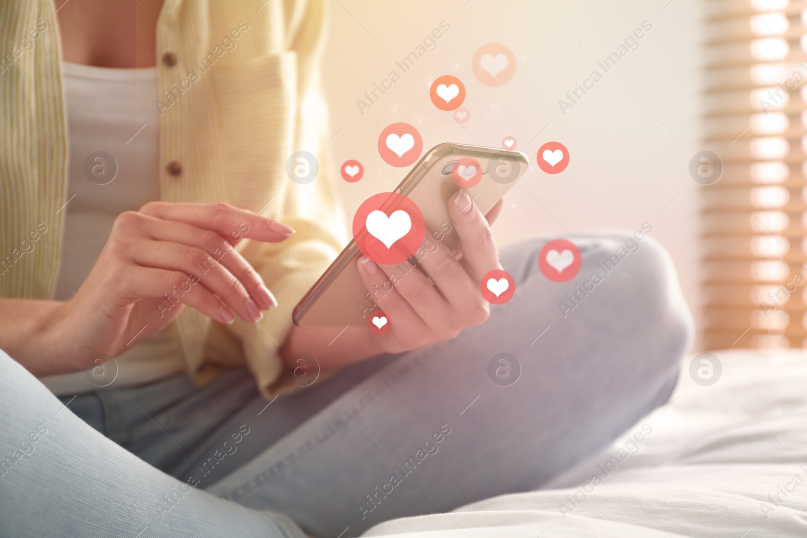 Image of Young woman using modern smartphone at home, closeup