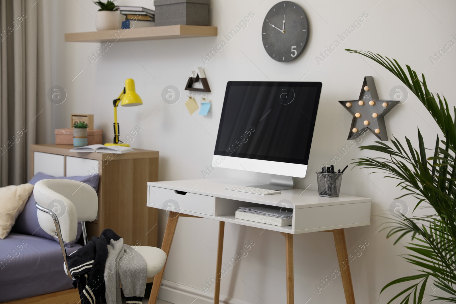 Photo of Modern teenager's room interior with stylish workplace