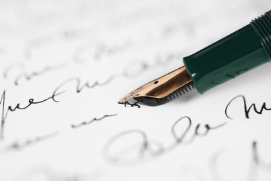 Photo of Writing letter with elegant fountain pen, closeup