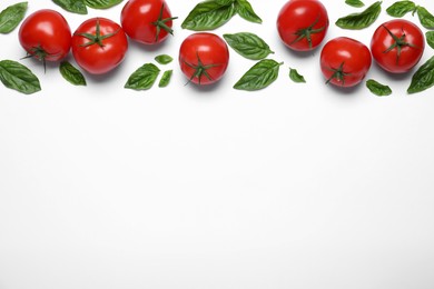 Fresh basil leaves and tomatoes on white background, flat lay. Space for text