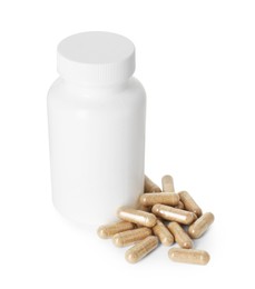 Bottle and pile of vitamin pills isolated on white