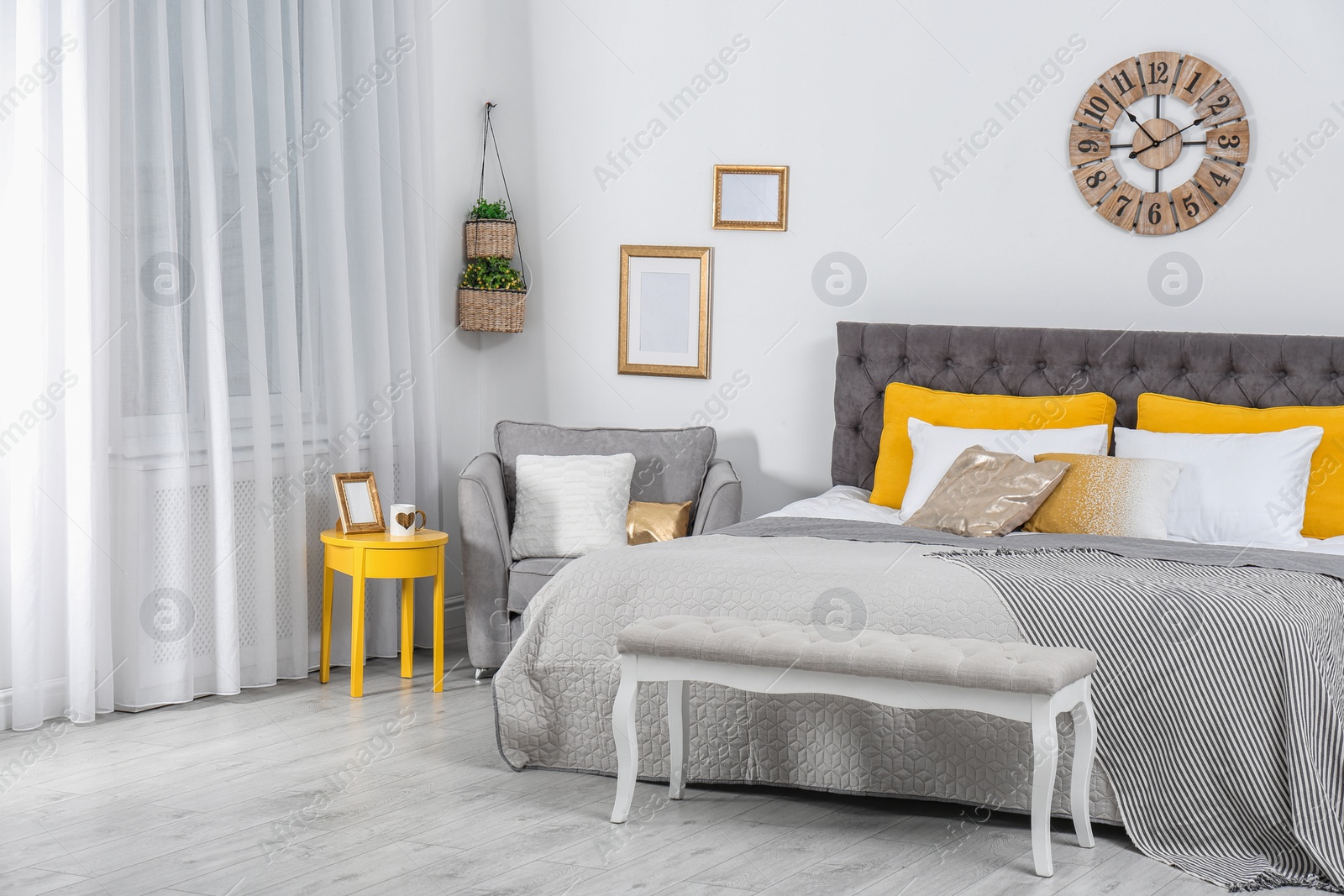 Photo of Stylish room interior with large comfortable bed