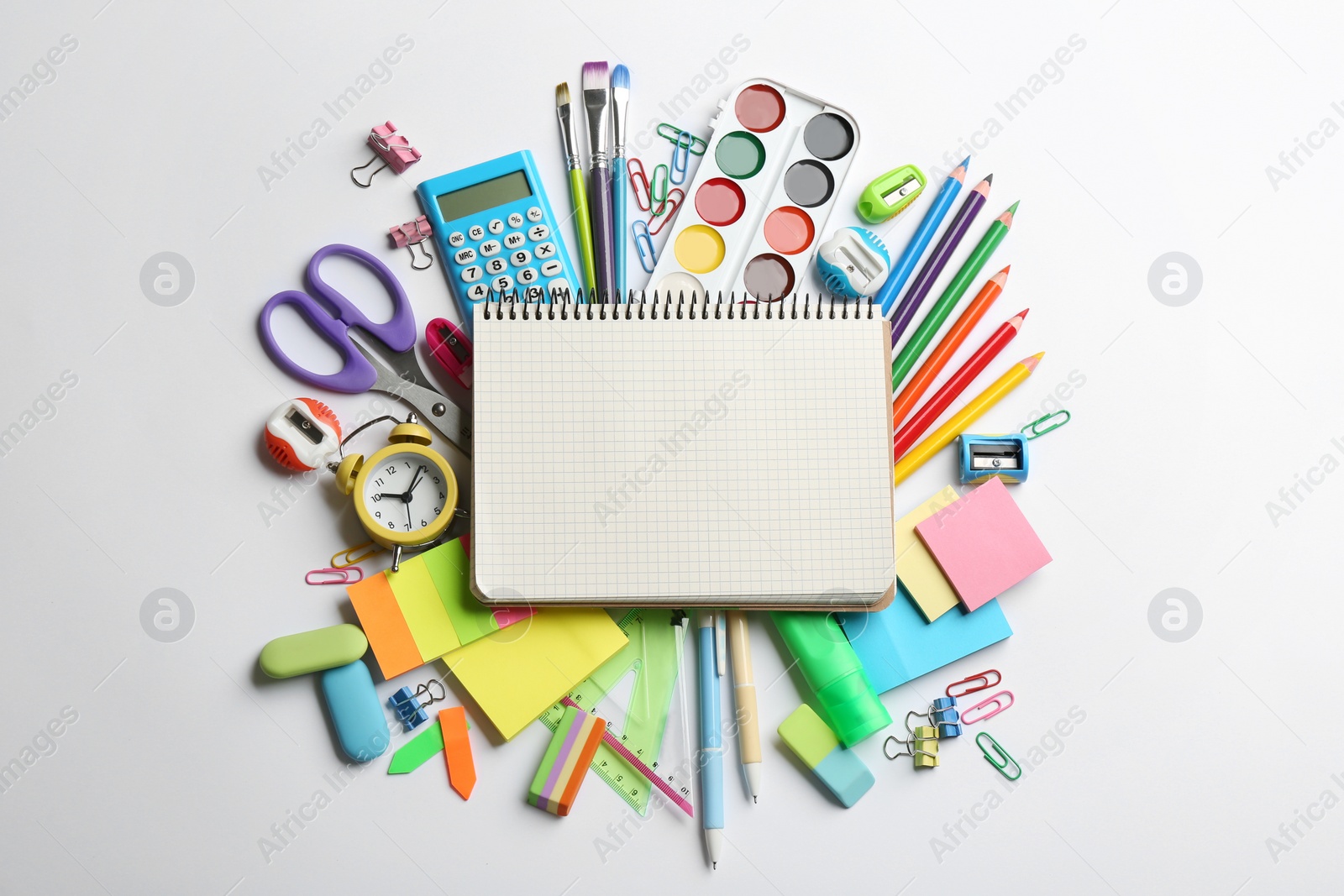 Photo of Blank notebook and school stationery on white background, flat lay with space for text. Back to school