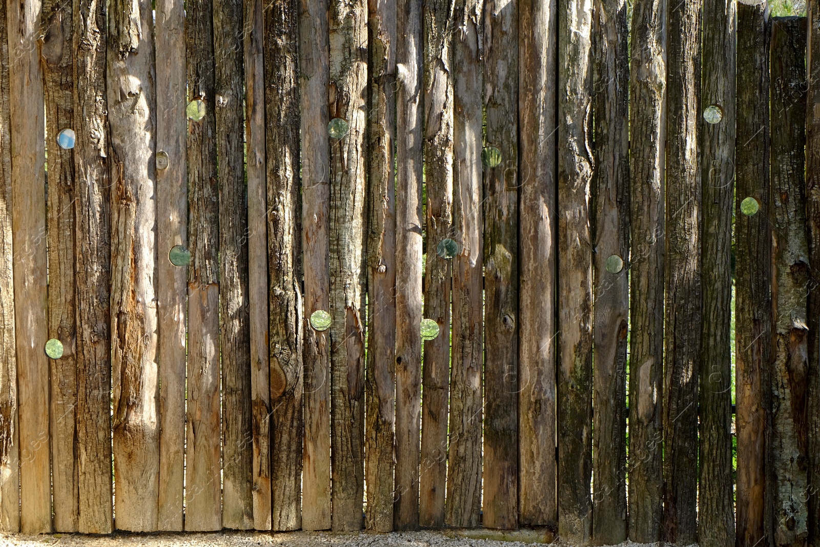 Photo of Wooden enclosure with holes to observe animals outdoors