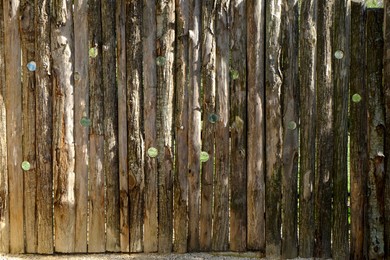 Wooden enclosure with holes to observe animals outdoors