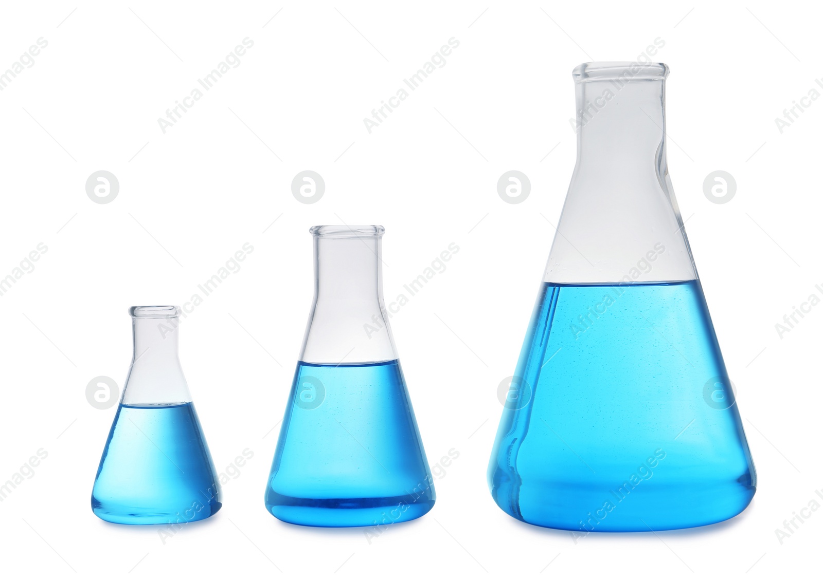 Photo of Conical flasks with blue liquid on white background. Laboratory glassware