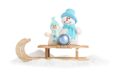 Wooden sleigh with snowmen on white background. Christmas holiday decor