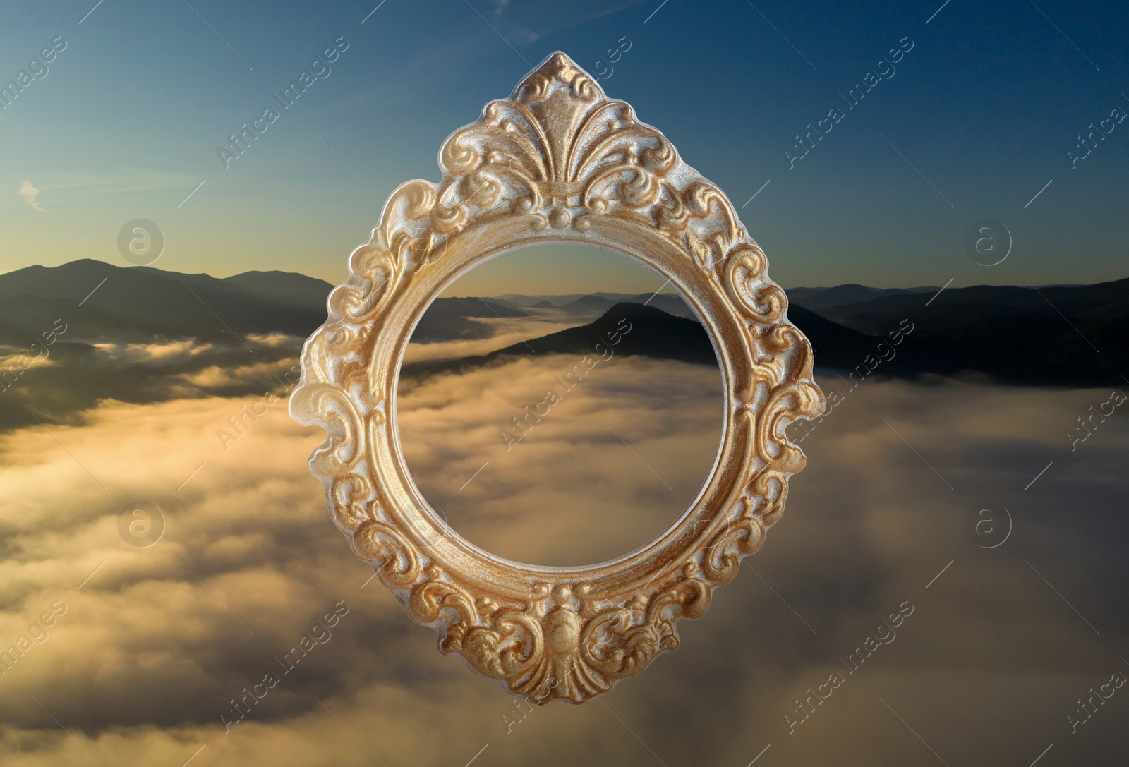 Image of Vintage frame and beautiful mountains covered with fog in morning