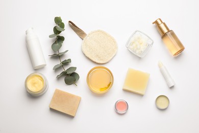 Photo of Flat lay composition with beeswax cosmetics on white background