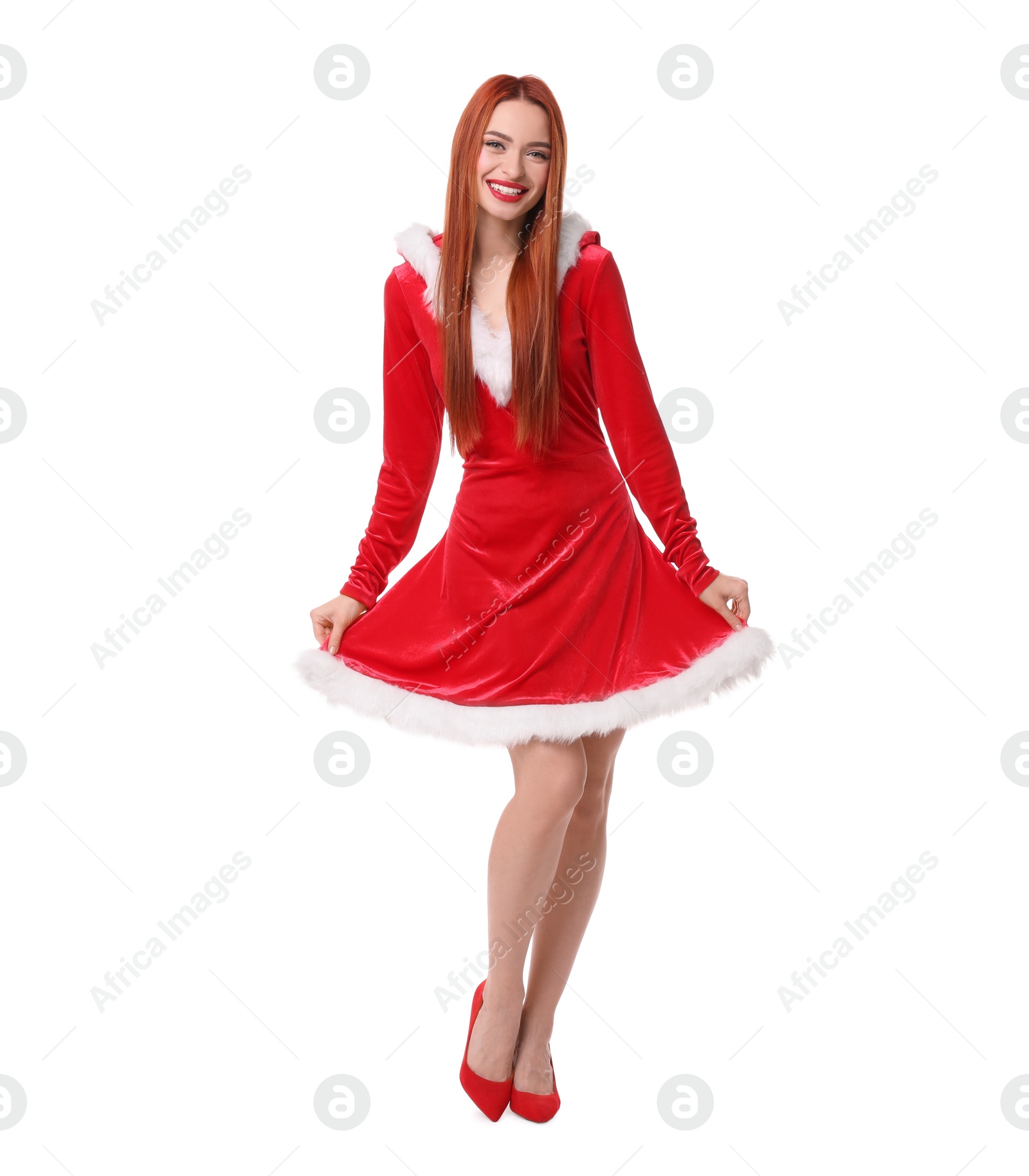Photo of Young woman in red dress on white background. Christmas celebration
