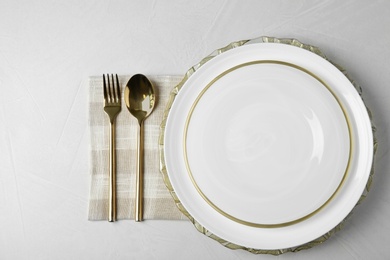 Photo of Beautiful table setting on grey background, top view