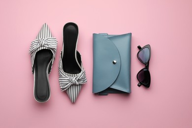 Stylish woman's bag, shoes and sunglasses on pink background, flat lay