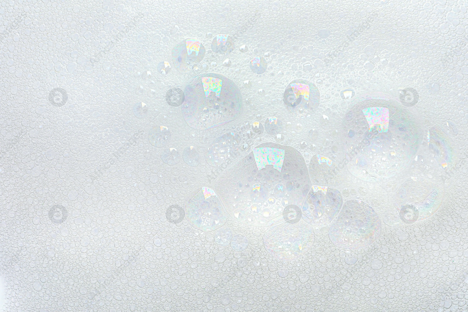 Photo of Fluffy soap foam as background, top view