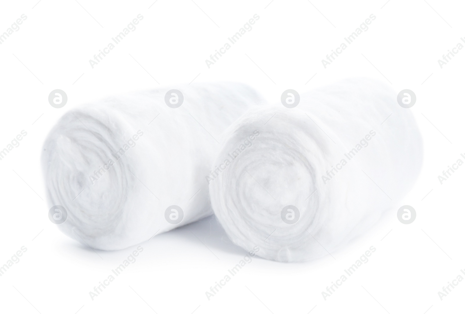 Photo of Soft clean cotton rolls on white background