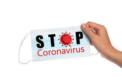 Image of Woman holding medical mask with text Stop Coronavirus on white background, closeup. Protective measures during pandemic