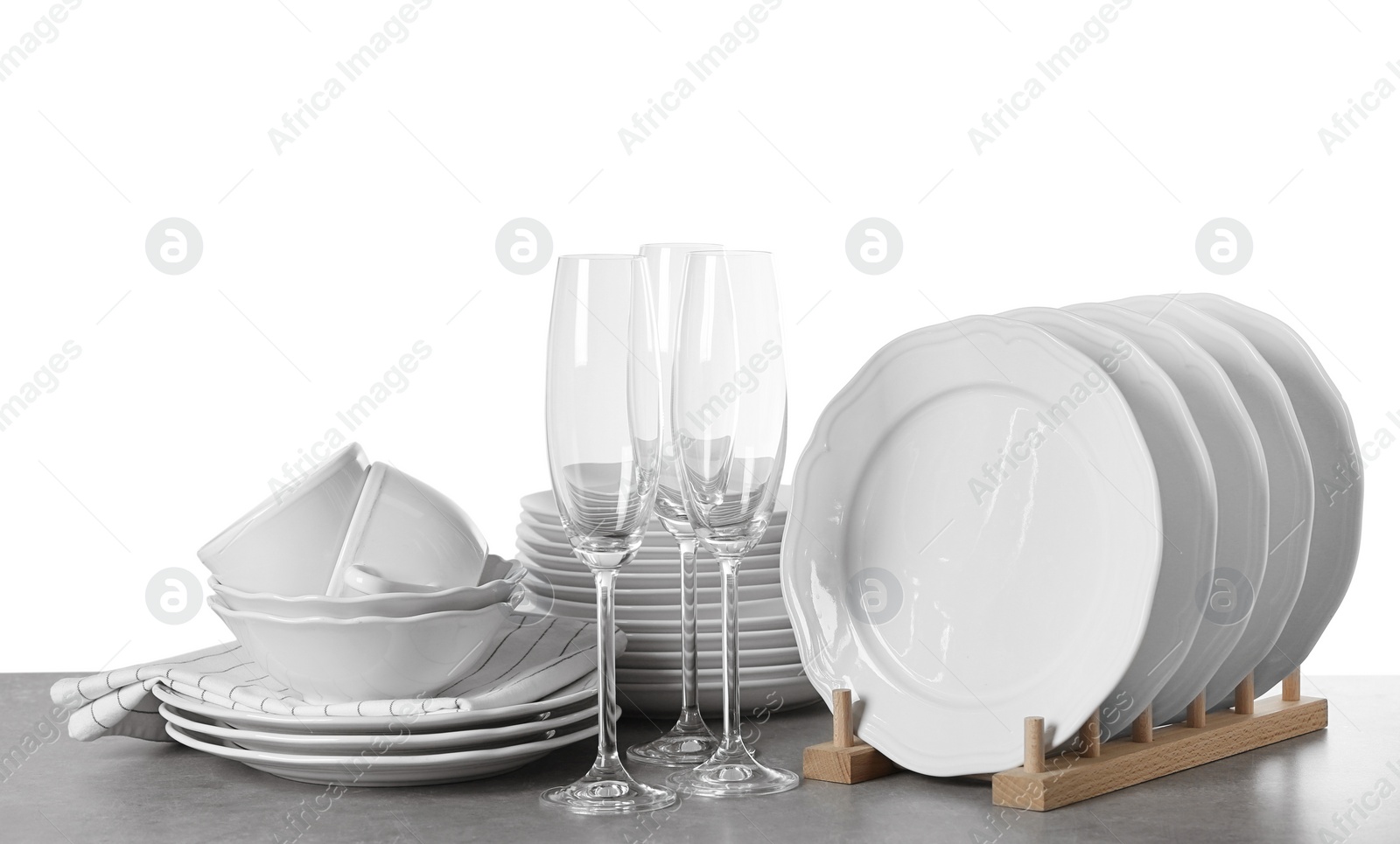 Photo of Set of clean dishes on white background