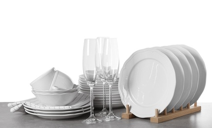 Photo of Set of clean dishes on white background