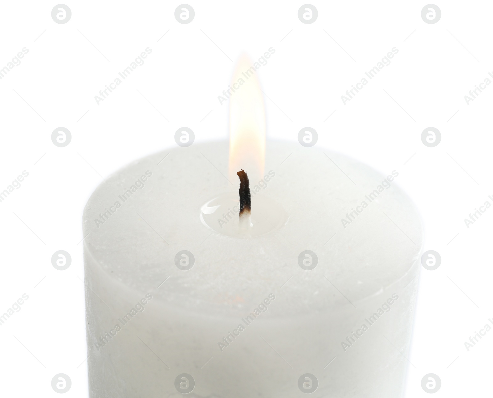 Photo of Burning wax candle on white background, closeup