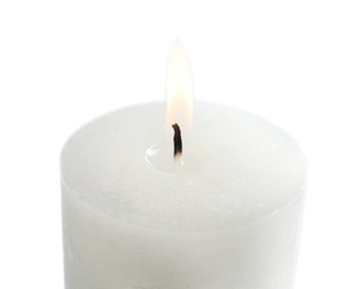 Photo of Burning wax candle on white background, closeup