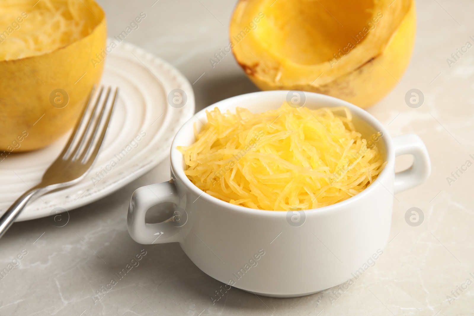 Photo of Cooked spaghetti squash in bowl served on table