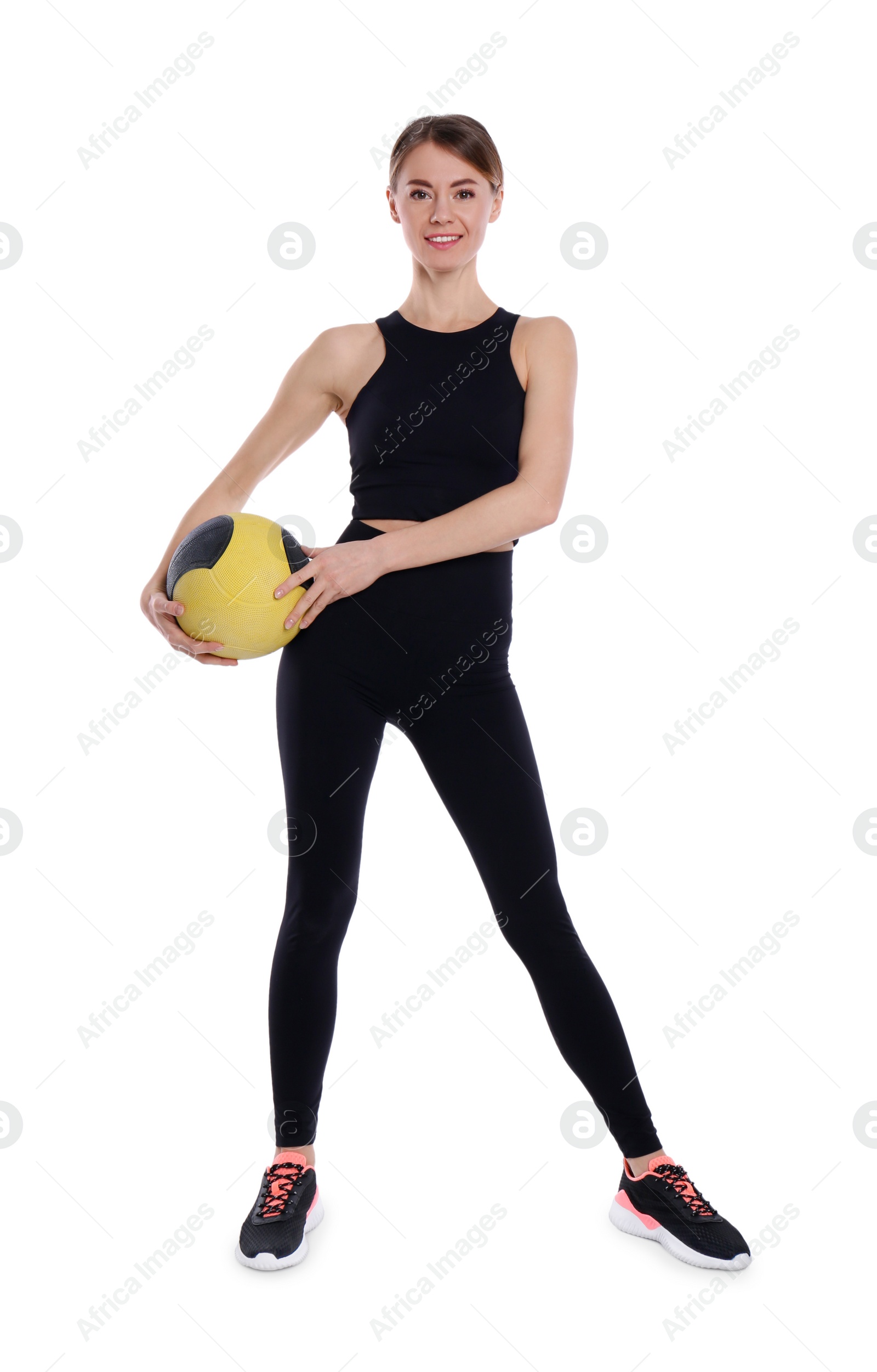 Photo of Athletic woman with medicine ball isolated on white