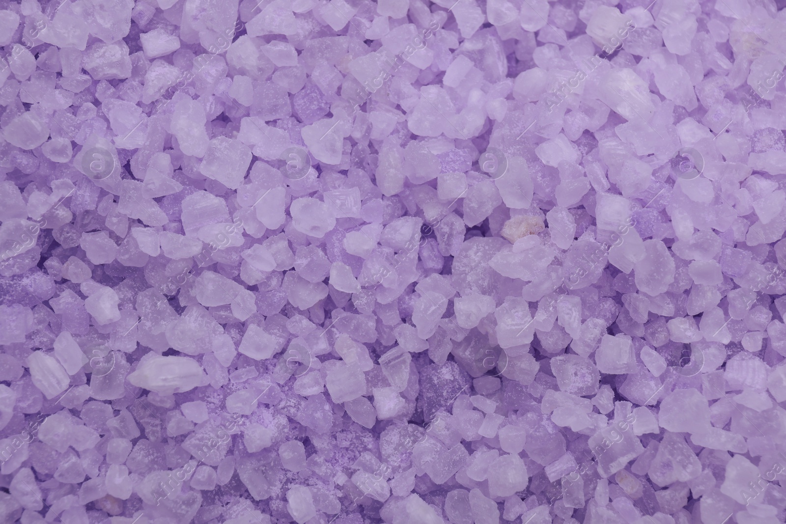 Photo of Violet sea salt as background, top view