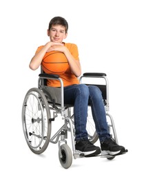 Photo of Disabled teenage boy in wheelchair with basketball ball on white background