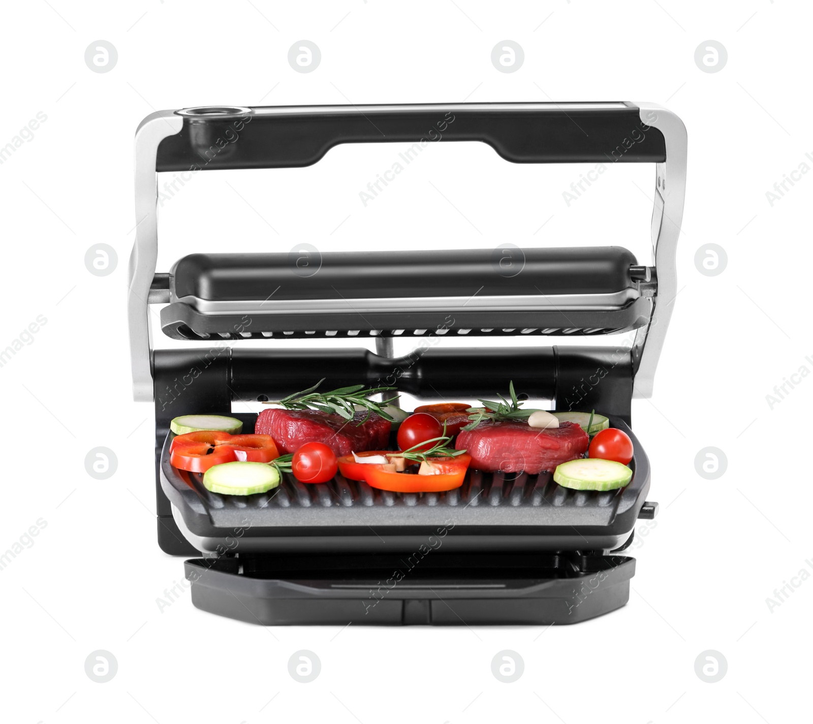 Photo of Electric grill with raw meat, rosemary and vegetables isolated on white