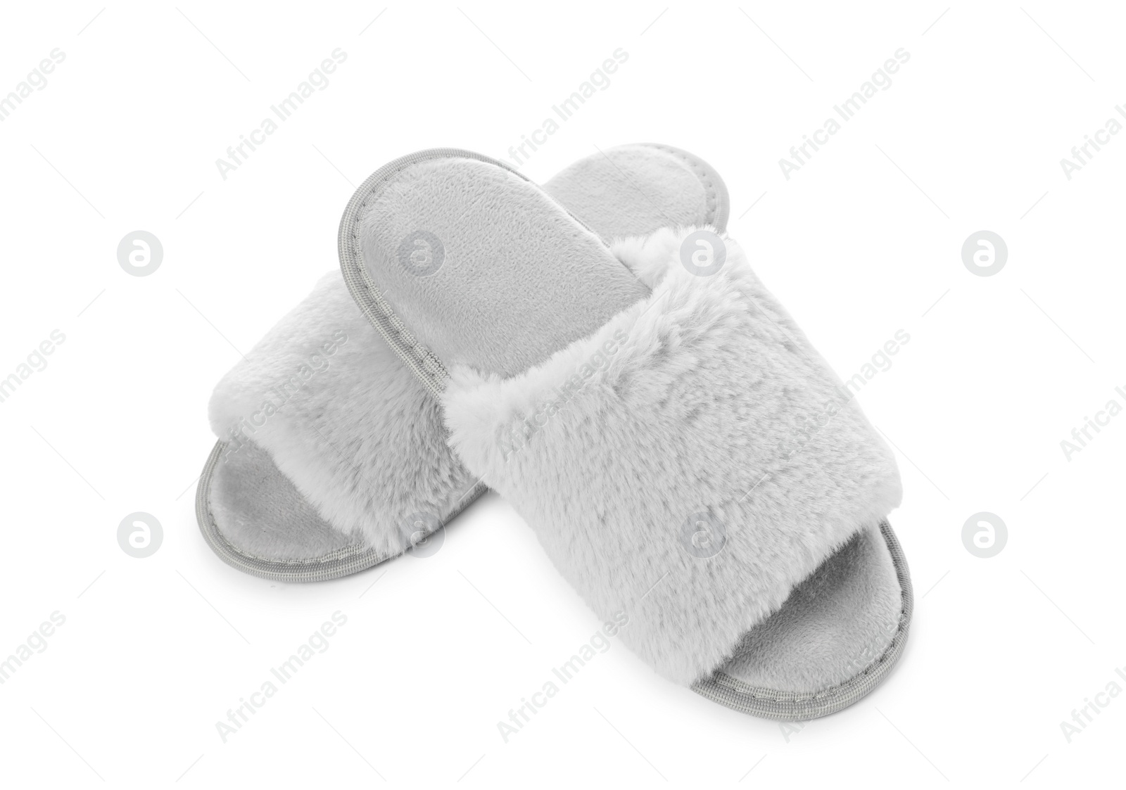Photo of Pair of soft slippers with fur isolated on white