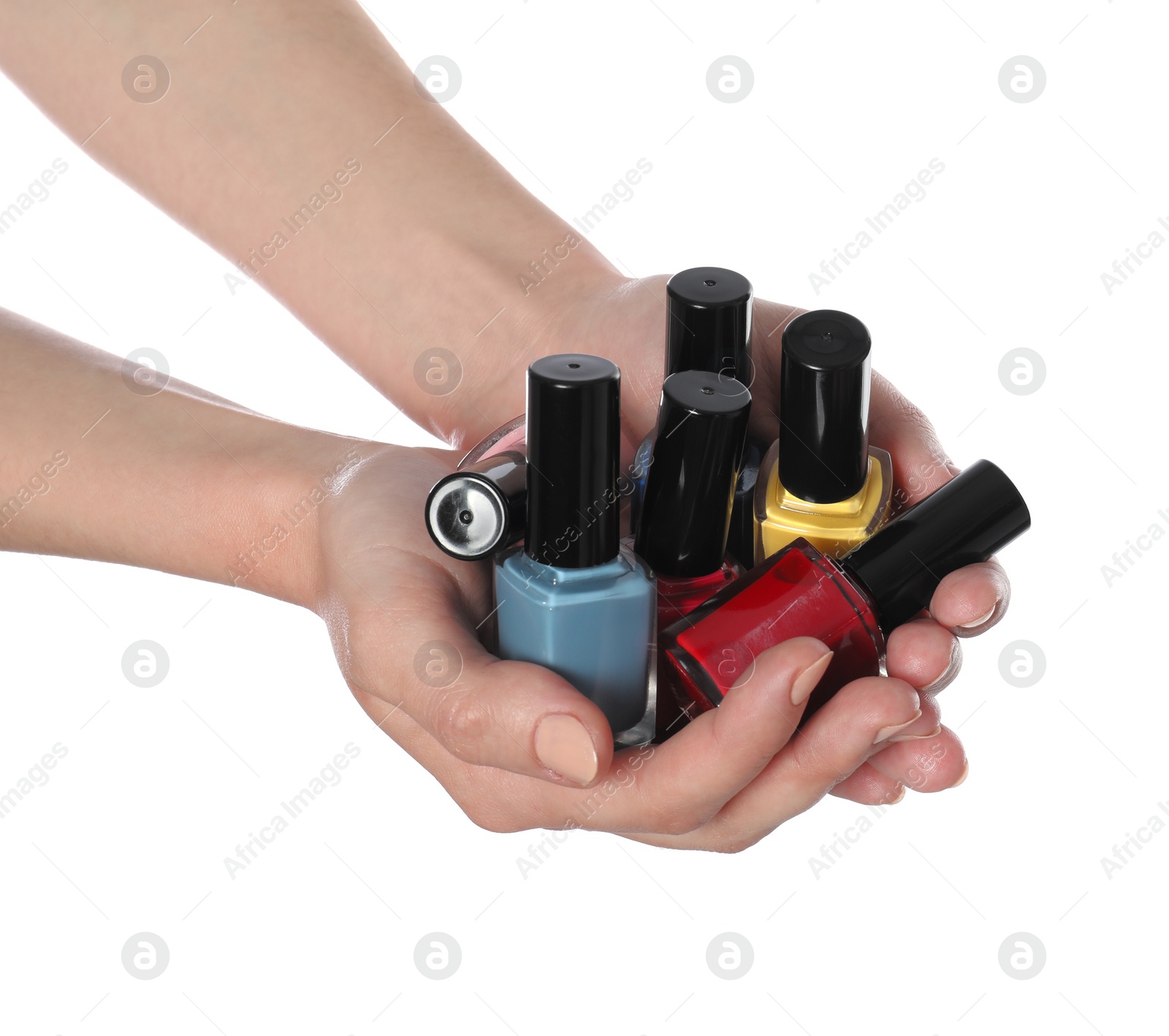 Photo of Woman holding nail polishes on white background, closeup