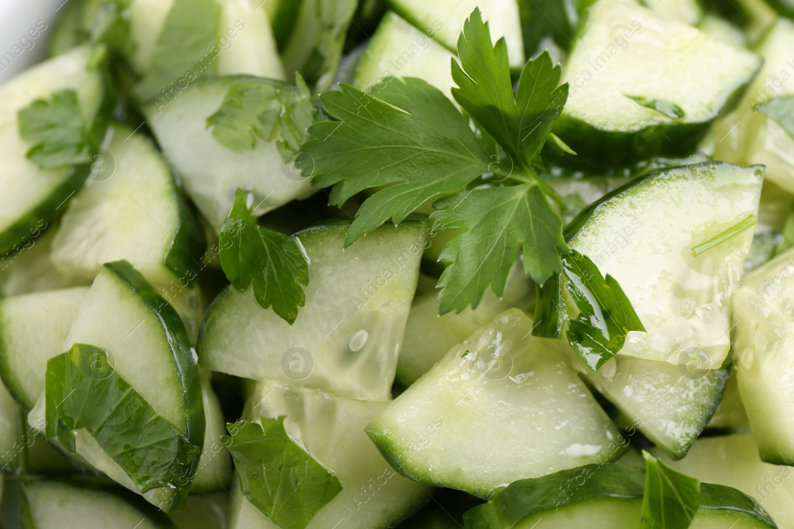 Photo of Delicious cucumber salad as background, top view