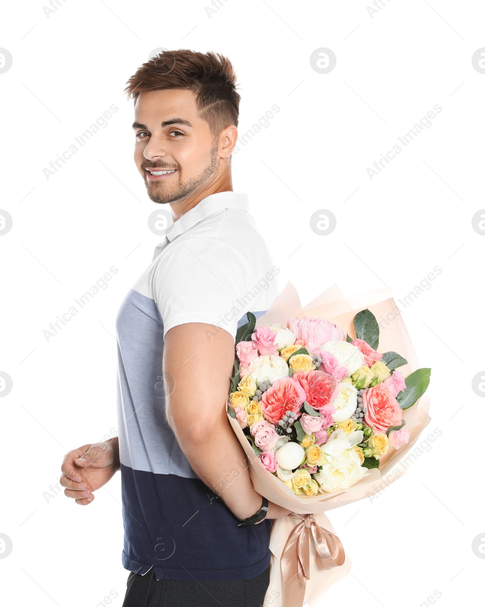 Photo of Young handsome man holding beautiful flower bouquet on white background